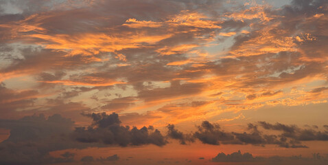 Wall Mural - golden sky with bright and dark cloud. fantastic nature background