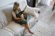 © millaf (Nemchinova) - Adorable young girl and cat pet together at home. Friendship and care