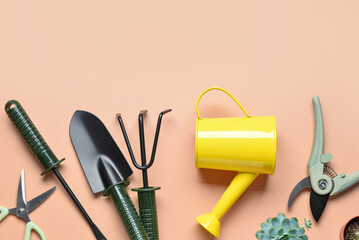 Wall Mural - Set of gardening tools on beige background