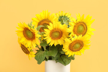 Canvas Print - Vase with sunflowers near color wall, closeup