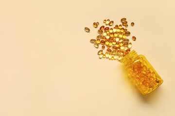 Wall Mural - Overturned bottle with fish oil capsules on color background