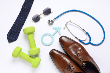 Wall Mural - Shoes, dumbbells, stethoscope and male sign isolated on white background. Prostate cancer awareness