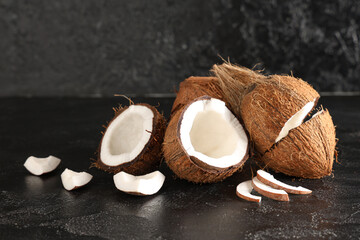 Fresh coconuts on black background