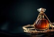 © MUdaylah - Photo of a bottle of perfume with copy space, on a black background, with a golden chain around it and a pearl hanging from the neck.