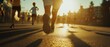 © Zoro - Runners legs close up at sunset during a marathon.