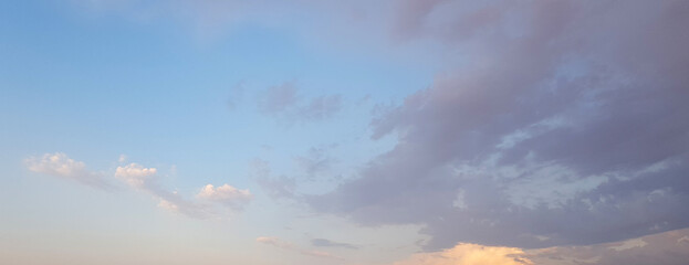 Wall Mural - beautiful sky, dawn background. blue sky with gentle pastel clouds and sun light