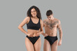 © Pixel-Shot - Young couple in stylish underwear on grey background