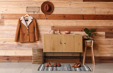 Wall Mural - Interior of hallway with chest of drawers and coat on hanger