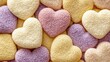 © Biggy - Colorful Heart-Shaped Gummies in Pastel Shades on Soft Background