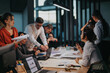 © qunica.com - A multicultural team of people engaging in a brainstorming session. Colleagues are discussing ideas, analyzing proposals, and strategizing for business success in a contemporary office environment.