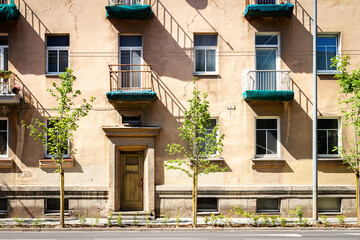 Soviet era architecture style of living district in Vilnius, Lithuania. Post-soviet urban architecture. Wall with windows and balconies.