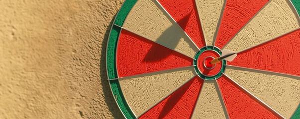 Top down view of dartboard with dart hitting target