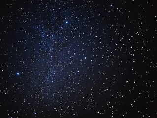Wall Mural - A starry night sky with a few stars visible. The sky is dark and the stars are scattered throughout