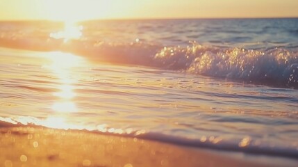 Wall Mural - a beautiful sunset reflecting on gentle ocean waves at the beach.