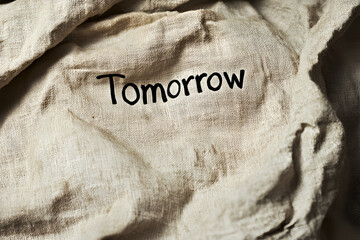 Tomorrow on Linen: A simple yet powerful message etched onto a piece of linen. The word 