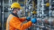 © Olga Ко - Photo in a Factory Setting. Engineer Wearing Safety Gear Working on a Water Purification System. Turning Valves on Pipes.