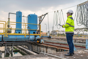 Wall Mural - Environmental engineers work at wastewater treatment plants,Water supply engineering working at Water recycling plant for reuse