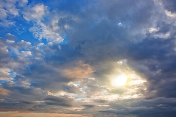 Wall Mural - Evening sunshine background with clouds dramatic sky.