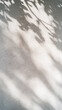 © Sergey - Minimalist shadow play on rugged surface with sunlit patterns