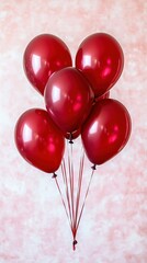 Wall Mural -   Red balloons float above a pink wall heart