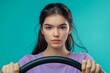 © Hunman - Photo of careful driver lady look empty space hold steering wheel wear purple shirt isolated turquoise color background.