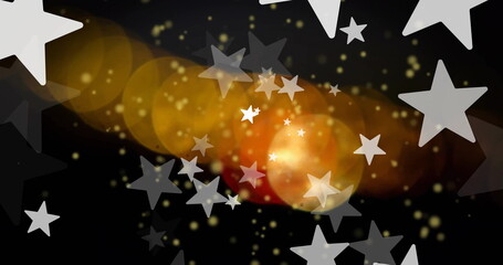 Canvas Print - Image of white stars over orange and yellow light spots on black background