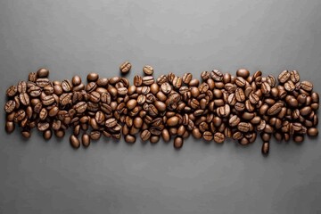 Wall Mural - Roasted coffee beans are spread evenly across a gray surface