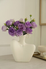 Wall Mural - Stylish vase with beautiful flowers and decor on white wooden table at home