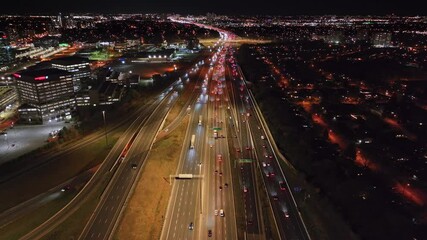 Wall Mural - Aerial night view of Highway 401 and 404 in Ontario with city lights and traffic flow