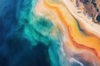 © SY - Aerial view of vibrant turquoise ocean meeting a sandy beach with orange and yellow hues. Perfect for travel, nature, or abstract design projects needing a calming, colorful aesthetic.