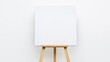 © Pure - Blank canvas on wooden easel in minimalistic studio setting, ideal for artistic expression