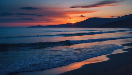 Wall Mural - serene coastal sunset over calm ocean waves with vibrant blue and orange hues and silhouetted hills 