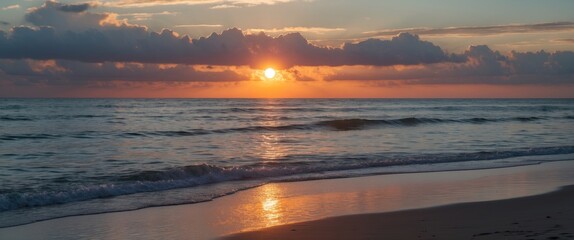Wall Mural - Serene Sunset Over Ocean Waves Reflecting on Sandy Beach with Cloudy Sky in the Background Ideal for Text Overlay and Relaxing Imagery
