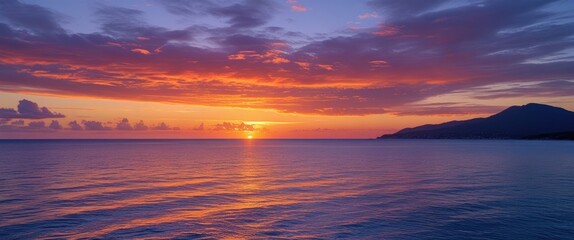 Wall Mural - stunning coastal sunset with vibrant orange and purple skies reflecting on tranquil blue waters, ide
