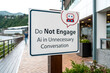 © F-STUDIO - A sign warns against engaging in unnecessary conversations with AI, displayed in a modern outdoor setting by a waterfront.