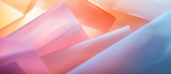 Colorful translucent paper layers creating a soft blur effect with light reflections for artistic or design backgrounds.