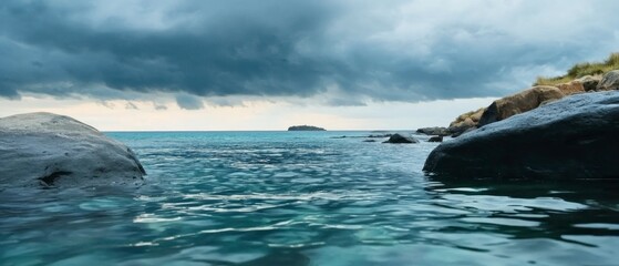 Canvas Print - Dark Clouds Over a Calm Ocean Near Rocky Coast