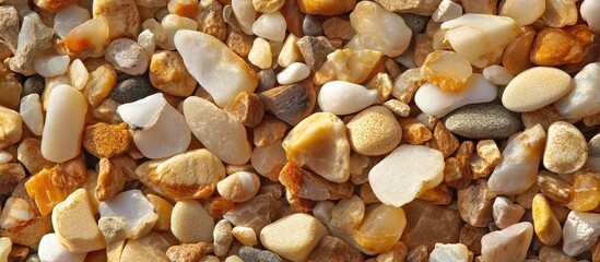 Poster - Multicolored sandy texture featuring a mixture of small pebbles and stones creating a natural, organic background suitable for various uses.