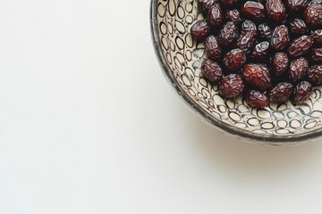 Wall Mural - Bowl of dried dates on white background.