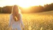 © Generative AI - Young woman walking through a golden field at sunset enjoying the beauty of nature and freedom : Generative AI