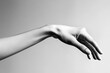 © Serhii - Outstretched Female Hand Reaching Towards Invisible Opportunity on White Background