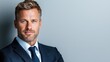 © tuiphotoengineer - Portrait of a confident and successful businessman standing in a formal suit and tie exuding an air of authority and professionalism