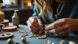 © Fuzzy08 Design - Focused hands assembling ornate earrings in a cozy jewelry workshop