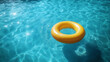 © Art of Ngu - Yellow Inflatable Ring Floating on Clear Blue Swimming Pool Water