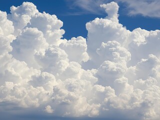 Wall Mural - A stunning blue sky with towering cumulus clouds that stretch high into the air, skiescape, blue sky