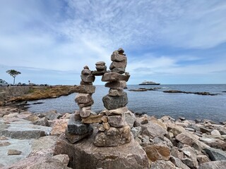 Wall Mural - stack of stones with the sea