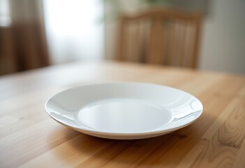 White ceramic plate with a scalloped edge on a light brown wooden surface showcasing a natural grain pattern perfect for culinary presentations or rustic home decor themes