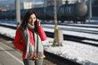 © LT - woman listen the phone on the platform of salzburg, austria
