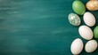 © Big9869 - Colorful Easter Eggs on Green Surface Artistic Layout Festive Celebration Happy Holiday Theme.