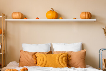 Wall Mural - Shelf with pumpkins on beige wall in bedroom